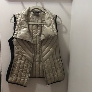 Gold and black Calvin Klein puffy vest.
